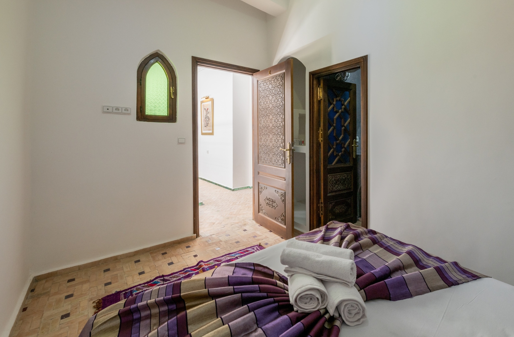 Our Rooms 3 Traditional riad bedroom with sea-tone palette